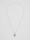 Sterling Silver Mini Disk and Toggle Necklace pictured on light grey background. 