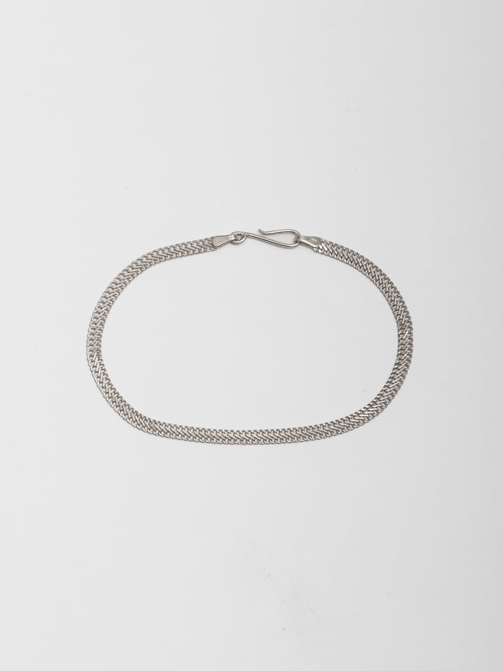 Sterling Silver Mesh Chain Bracelet pictured on light grey background.  
