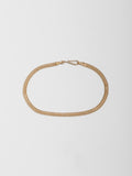 14kt Yellow Gold Mesh Chain Bracelet pictured on light grey background. 