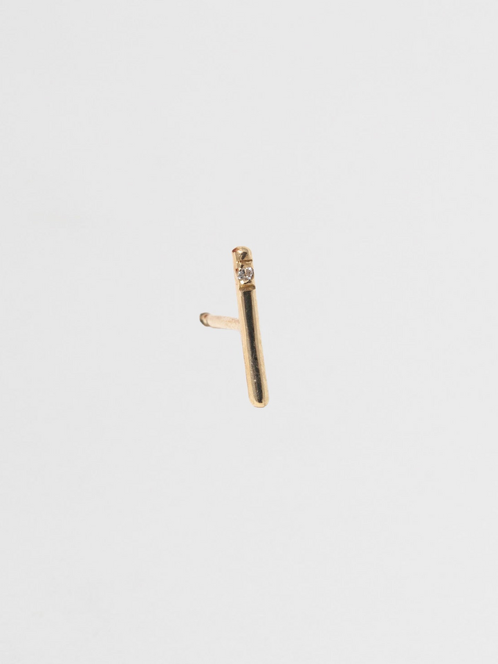 Solo Diamond Rod Stud pictured on light grey background. 