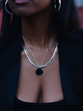Sterling Silver Serpentine Chain Necklace pictured on model. Layered with other necklaces.