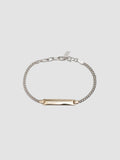 Mini Watts ID Necklace pictured on light grey background.