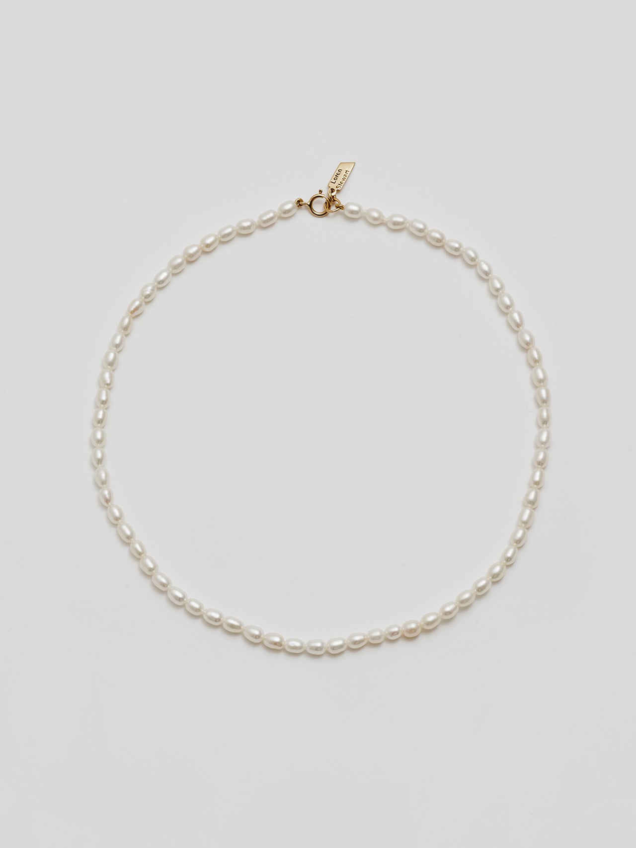 14kt Yellow Gold Rice Pearl Choker pictured on light grey background