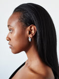Sterling Silver Hollow XL Hammock Hoops pictured on model from side profile. 