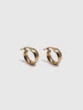 14kt Yellow Gold Hoops pictured on light grey background.