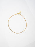 10kt Yellow Gold Valentino Chain Bracelet pictured on light grey background.
