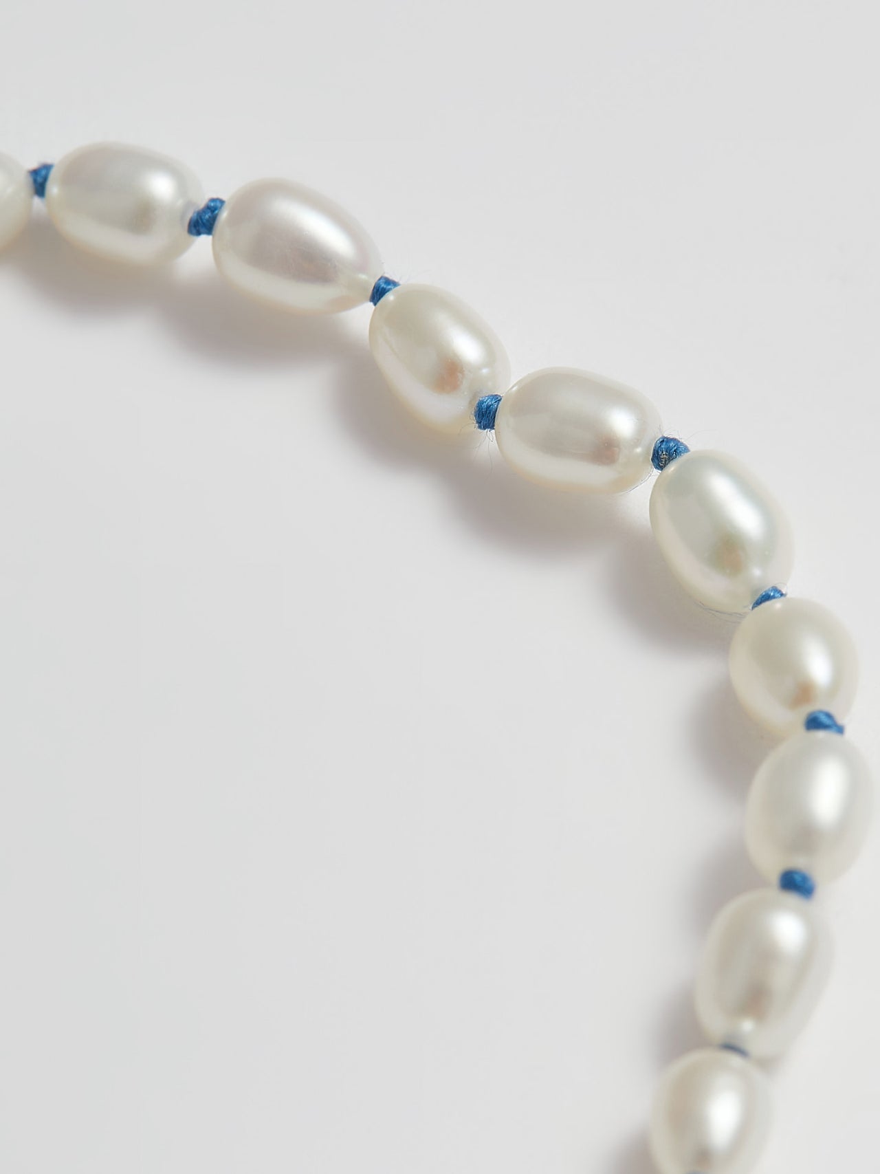 Close up of Freshwater Pearls with Blue String 
