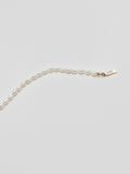 Product shot of White Rice Pearl Anklet including logo. Light grey background. 
