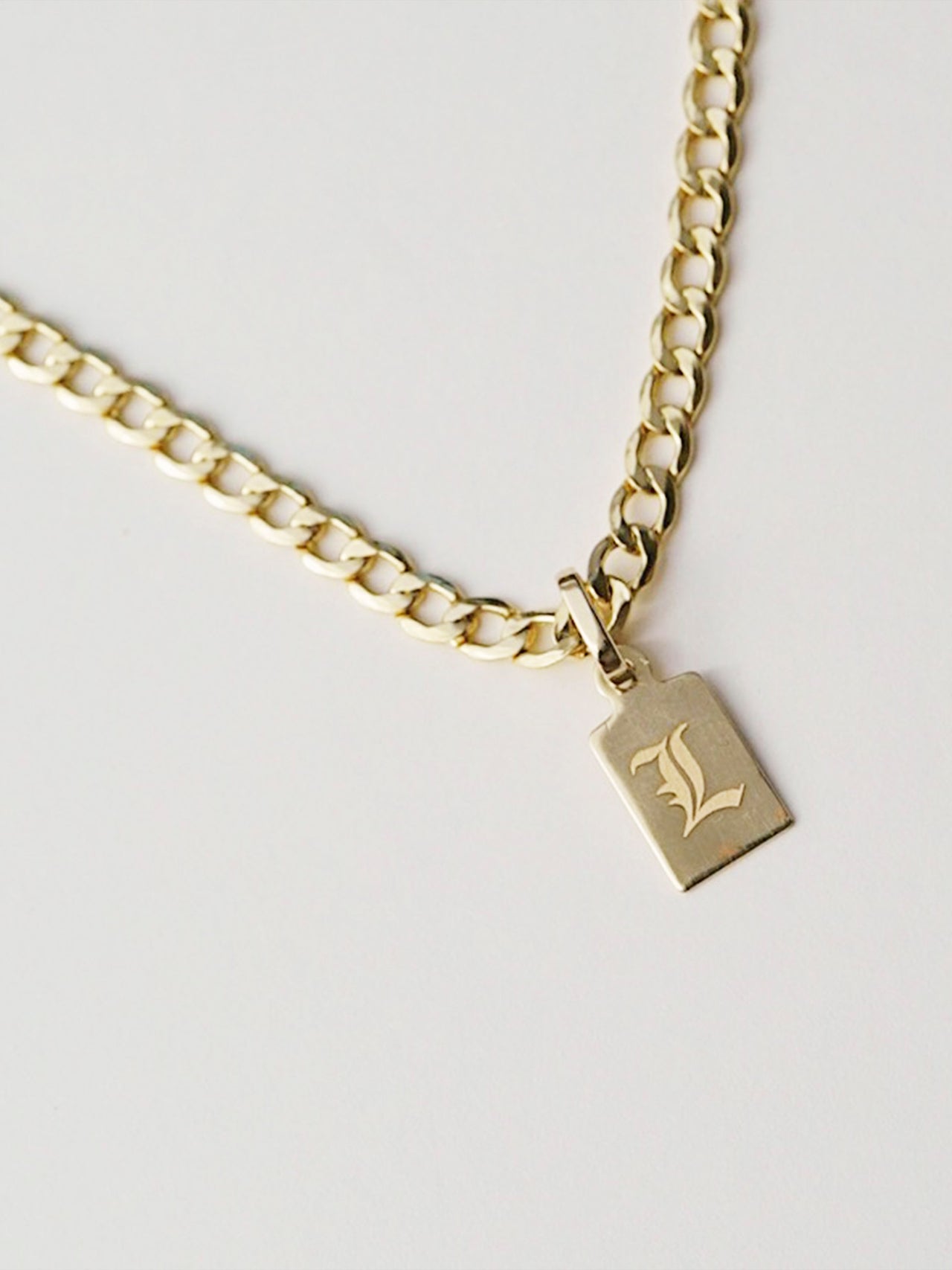 Klint Id Charm Pendant on chain with engraving: "L"