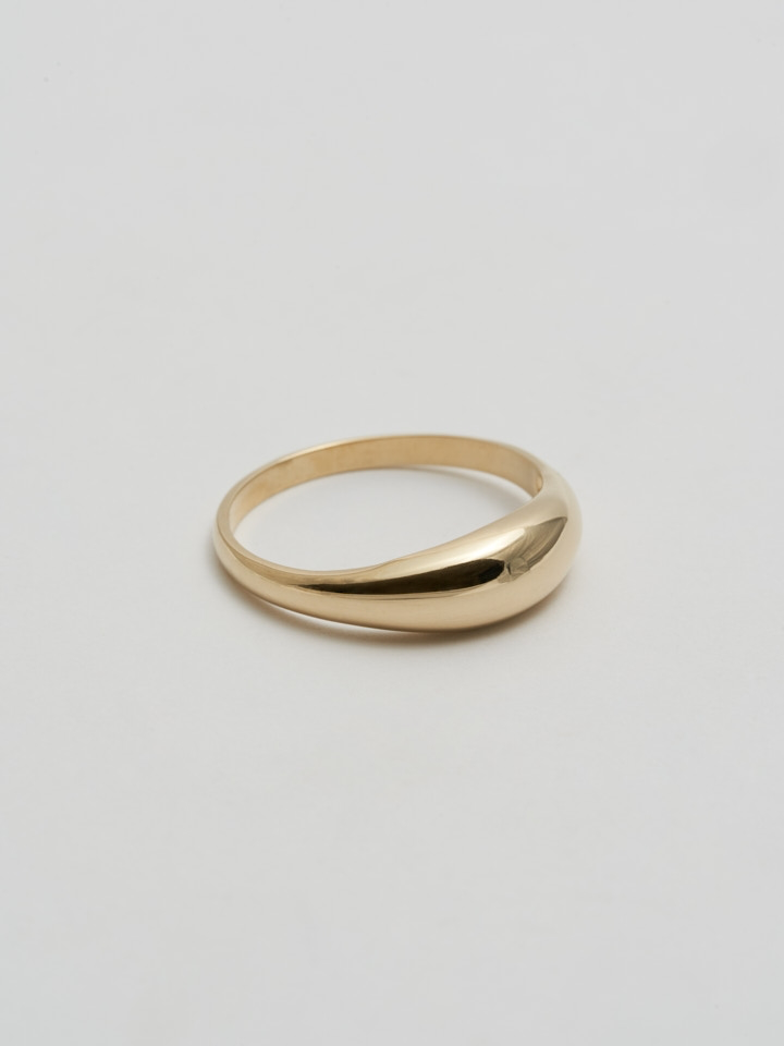 Side angle product shot of Dome Ring (14Kt Yellow Gold Dome Ring with a 5.3mm to 1.9mm Tapered Width) shot on white background