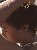 On model close up shot of ear wearing the Valle Hoops (14Kt Yellow Gold Hoops 0.47” Diameter Thickness: 1mm) 