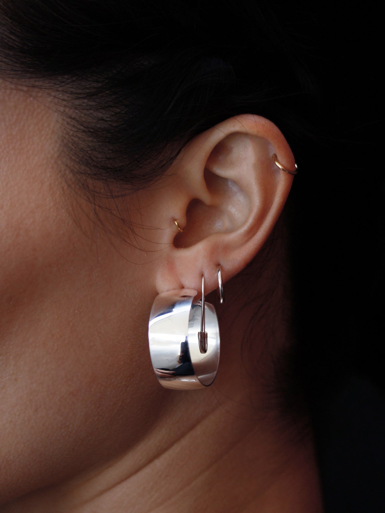Sterling Silver Safety Pin pictured in second piercing on model. 