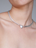 Suki Pearl Necklace pictured on models neck. Light grey background. 