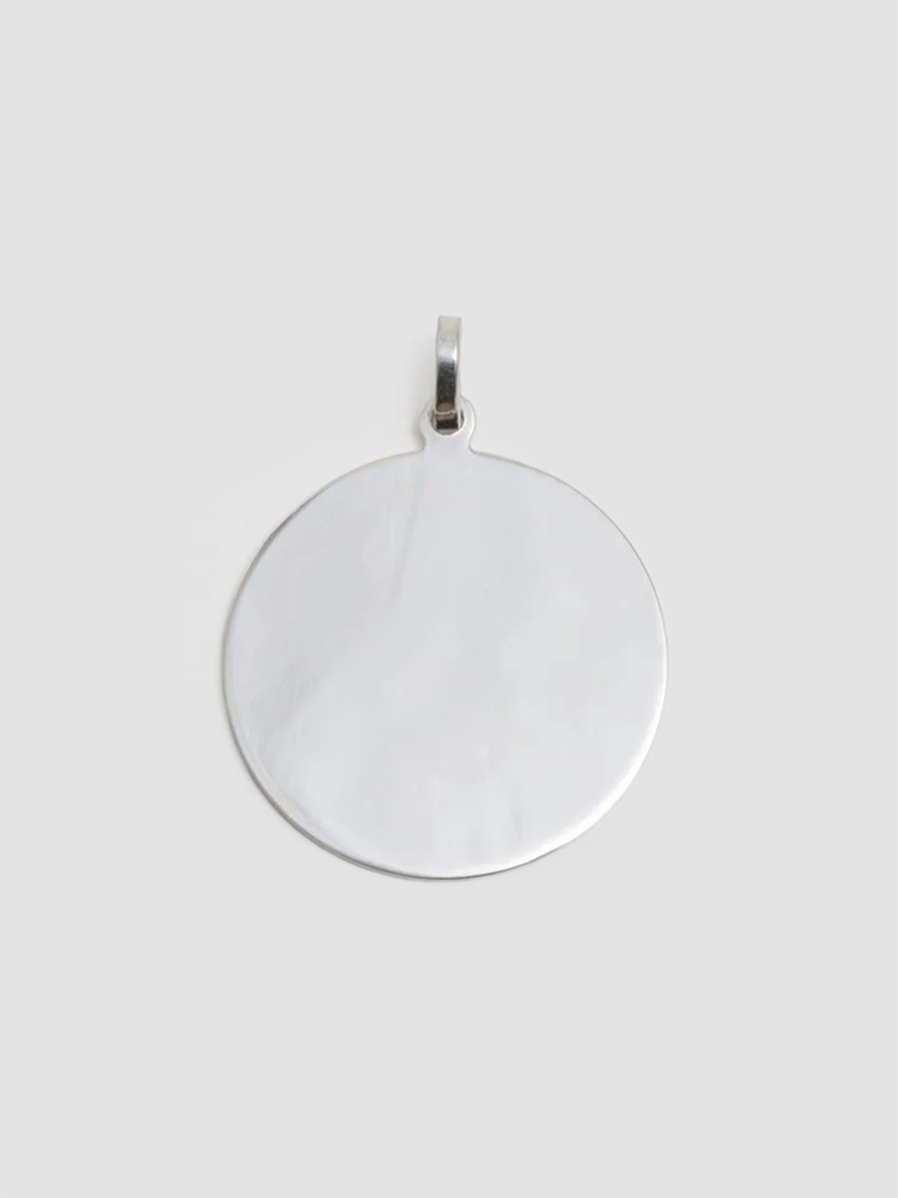 Silver pendant on a white background