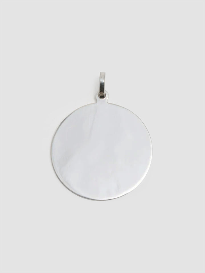 Silver pendant on a white background