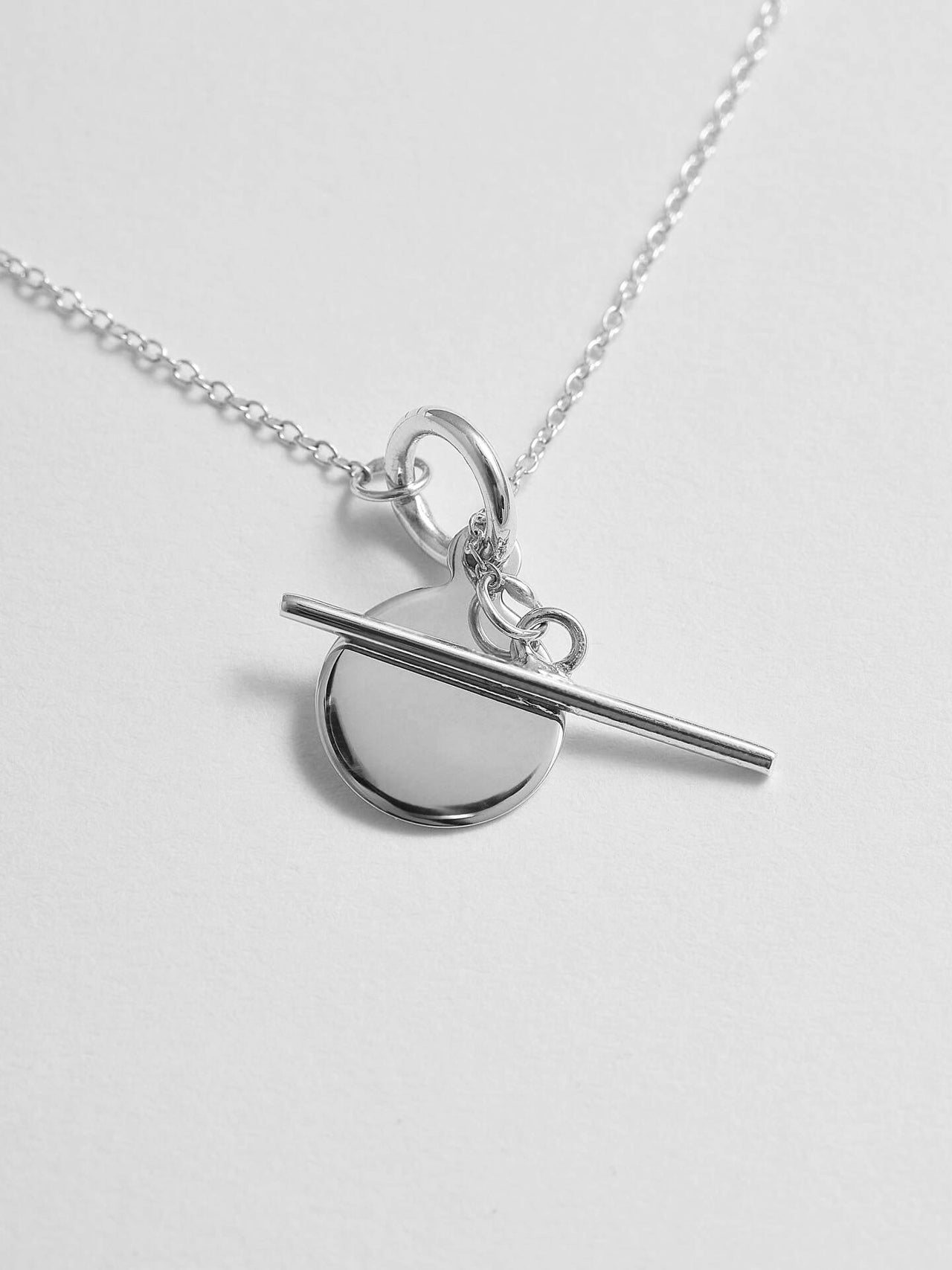 Close up shot of Sterling Silver Mini Disk and Toggle Necklace.