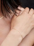 10kt Yellow Gold Valentino Chain Bracelet pictured on model.