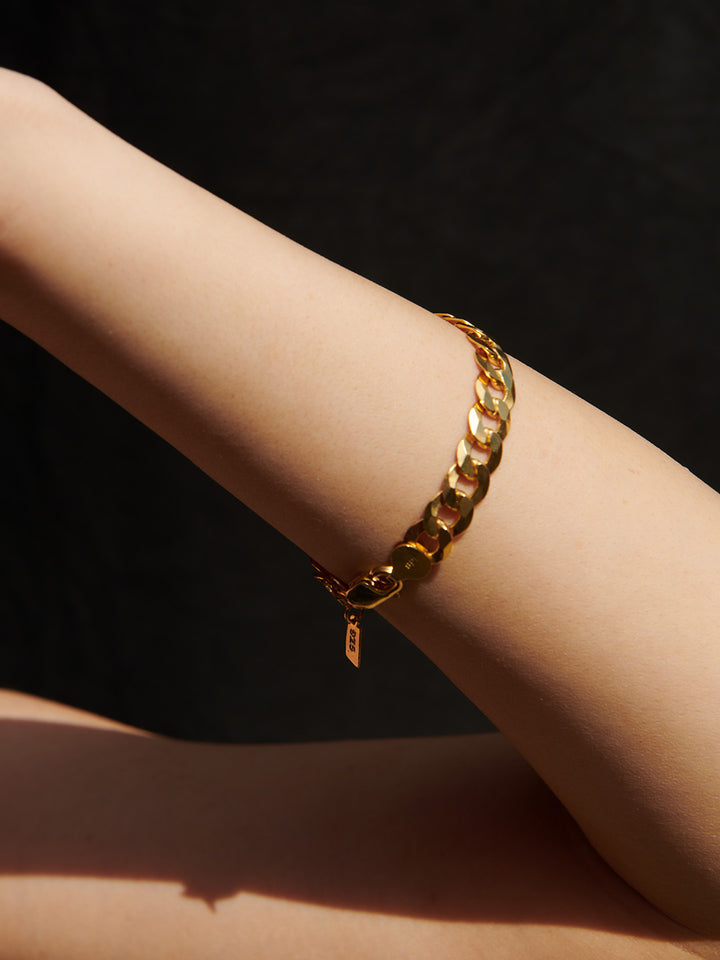 Vermeil Flat Curb Chain Bracelet pictured on models wrist.