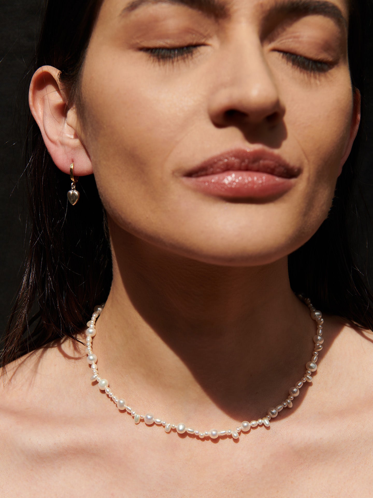 Belisimo Pearl Strand: Freshwater Mixed Pearl Strand 14kt Yellow Gold Closure 16'' Total Length pictured on model.