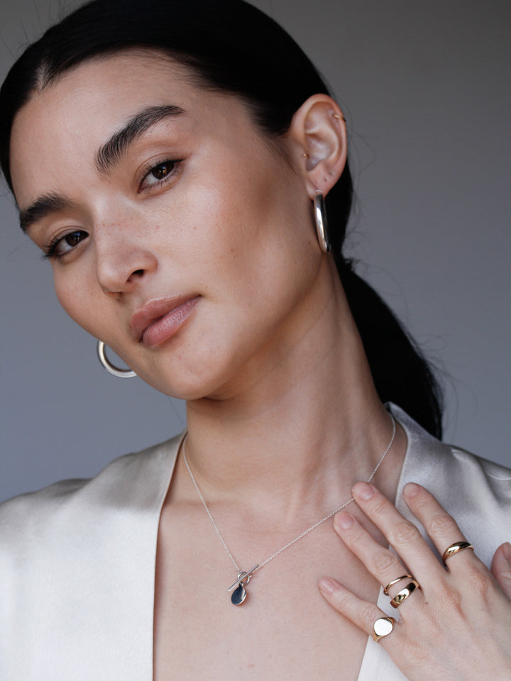 Mini Sterling Silver Disk & Toggle Necklace pictured on model. 