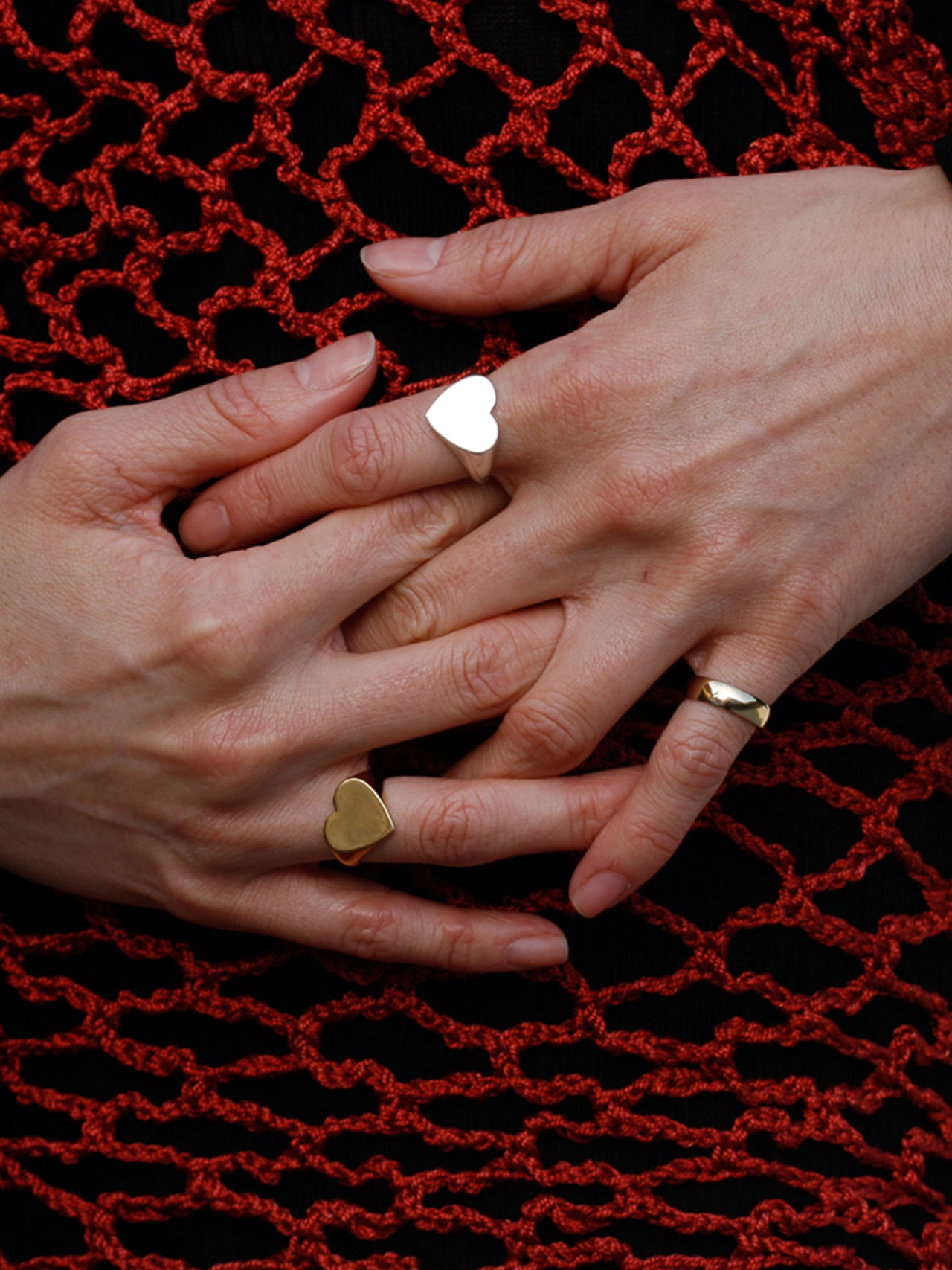Amore signet ring pictured on models right hand on pointer finger. 