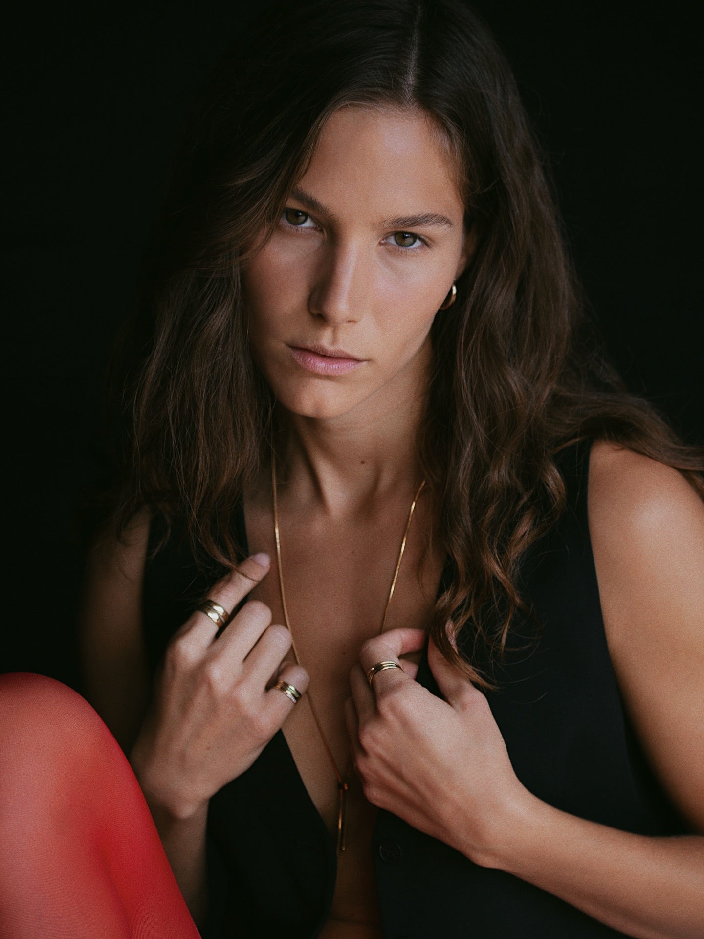 Vermeil Bolo Pendant Necklace pictured styled on model. Black background.