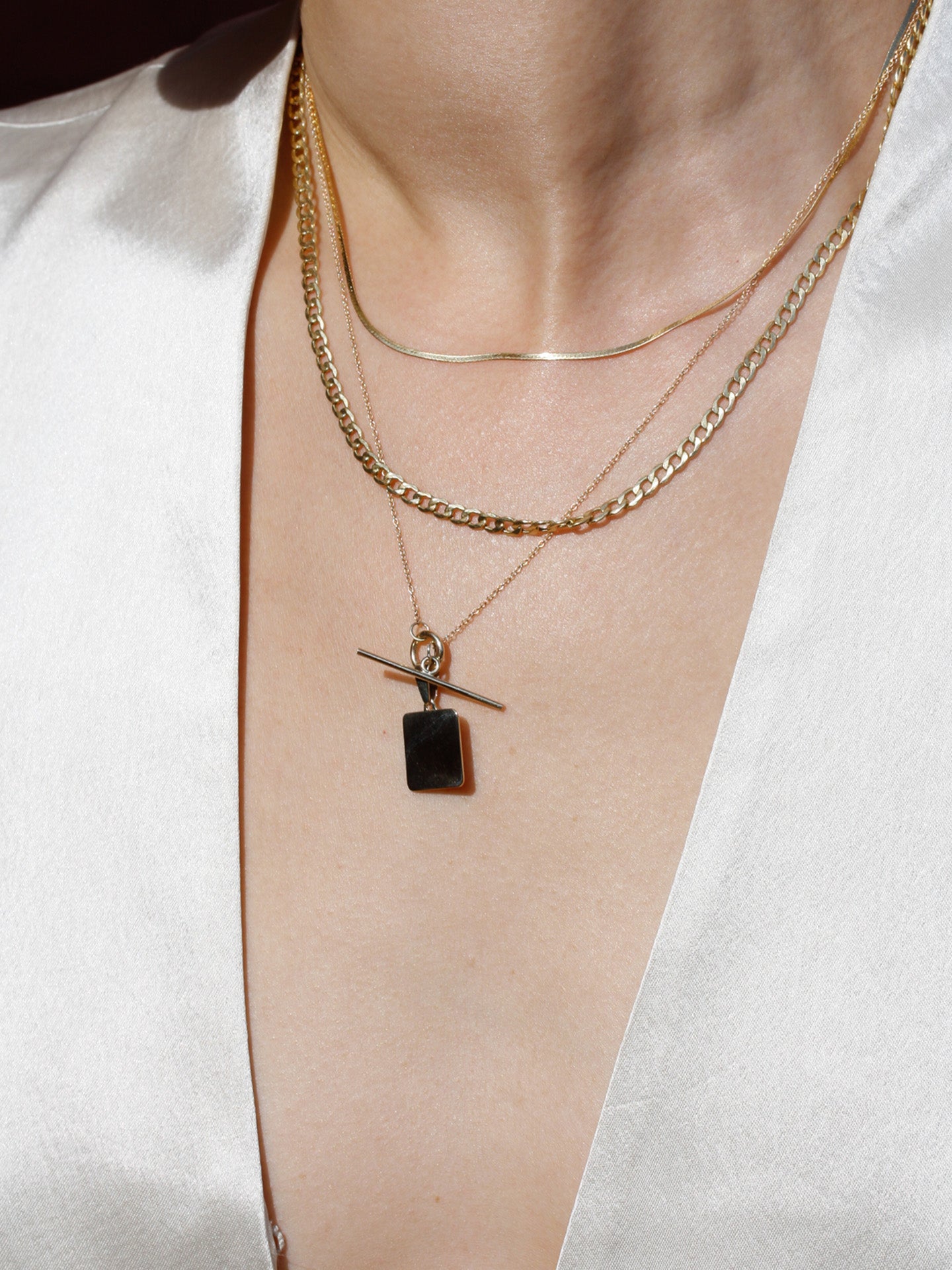 Lightweight Havana chain pictured on model. Second necklace in stack. 