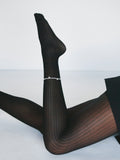 Contessa Pearl Anklet pictured on models ankle. Light grey background 