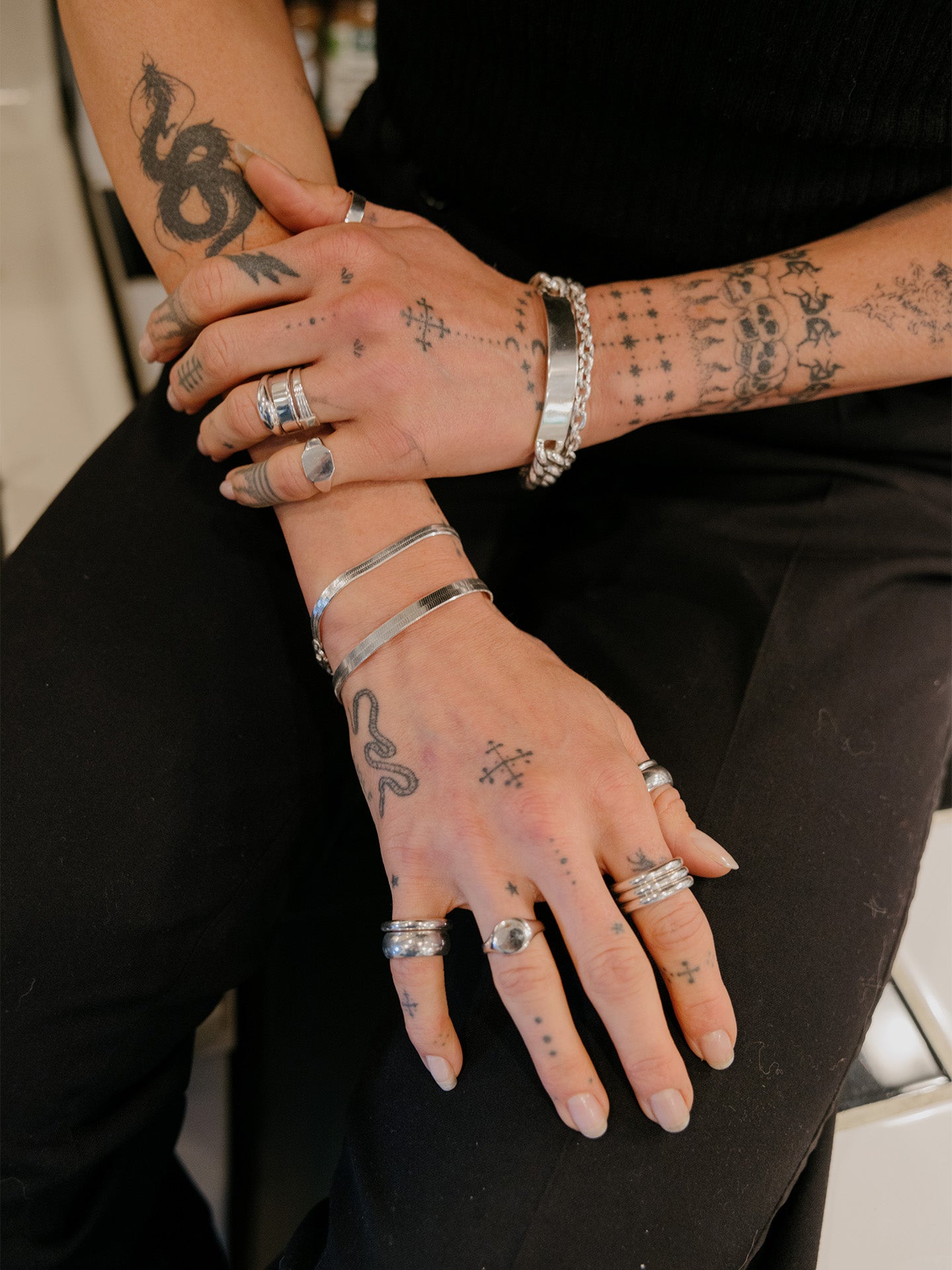Sterling Silver Herringbone Bracelet pictured on models wrist along with the XL Herringbone. 