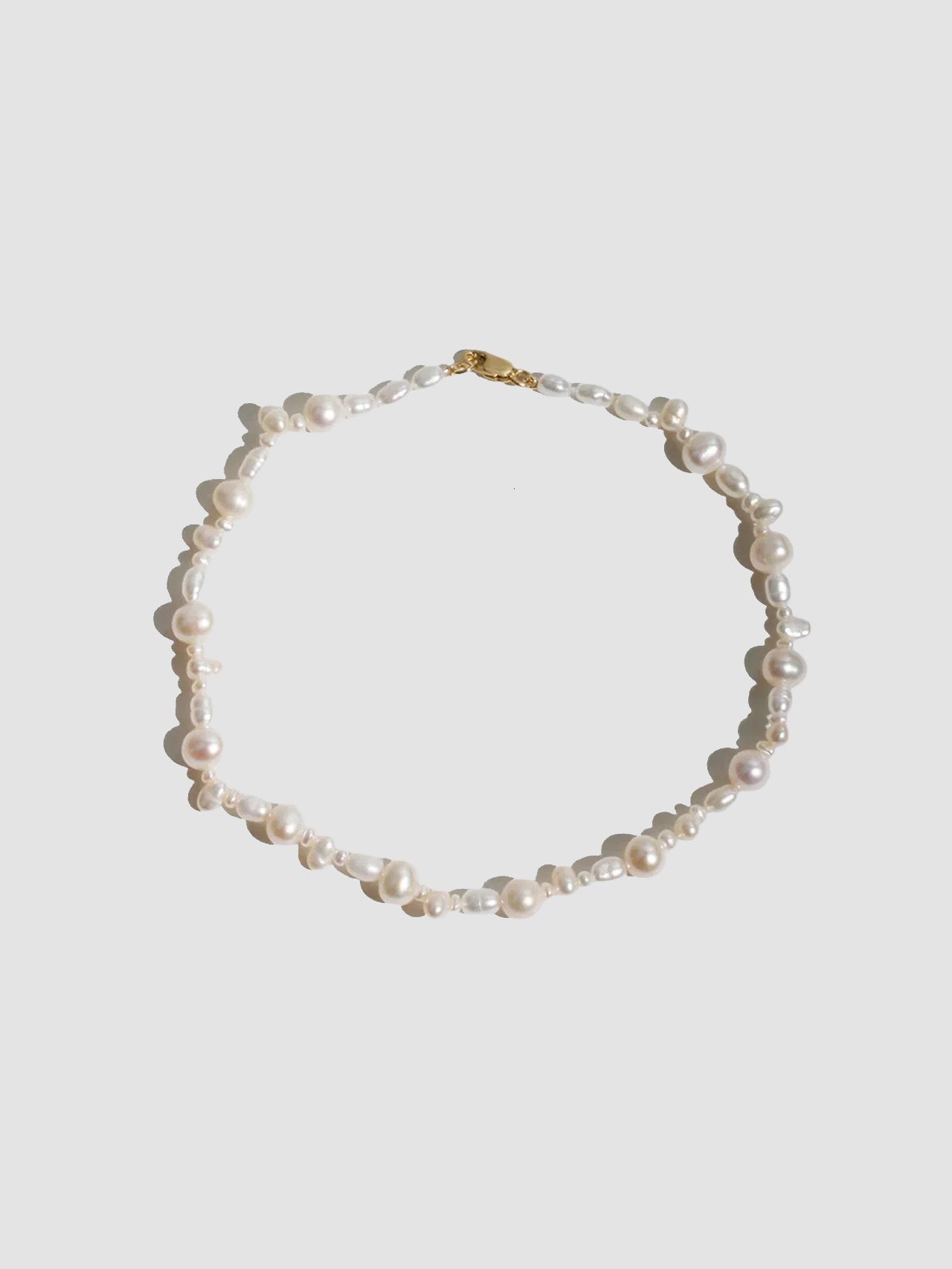 14kt Yellow Gold Bellissimo Pearl Anklet pictured on light grey background.