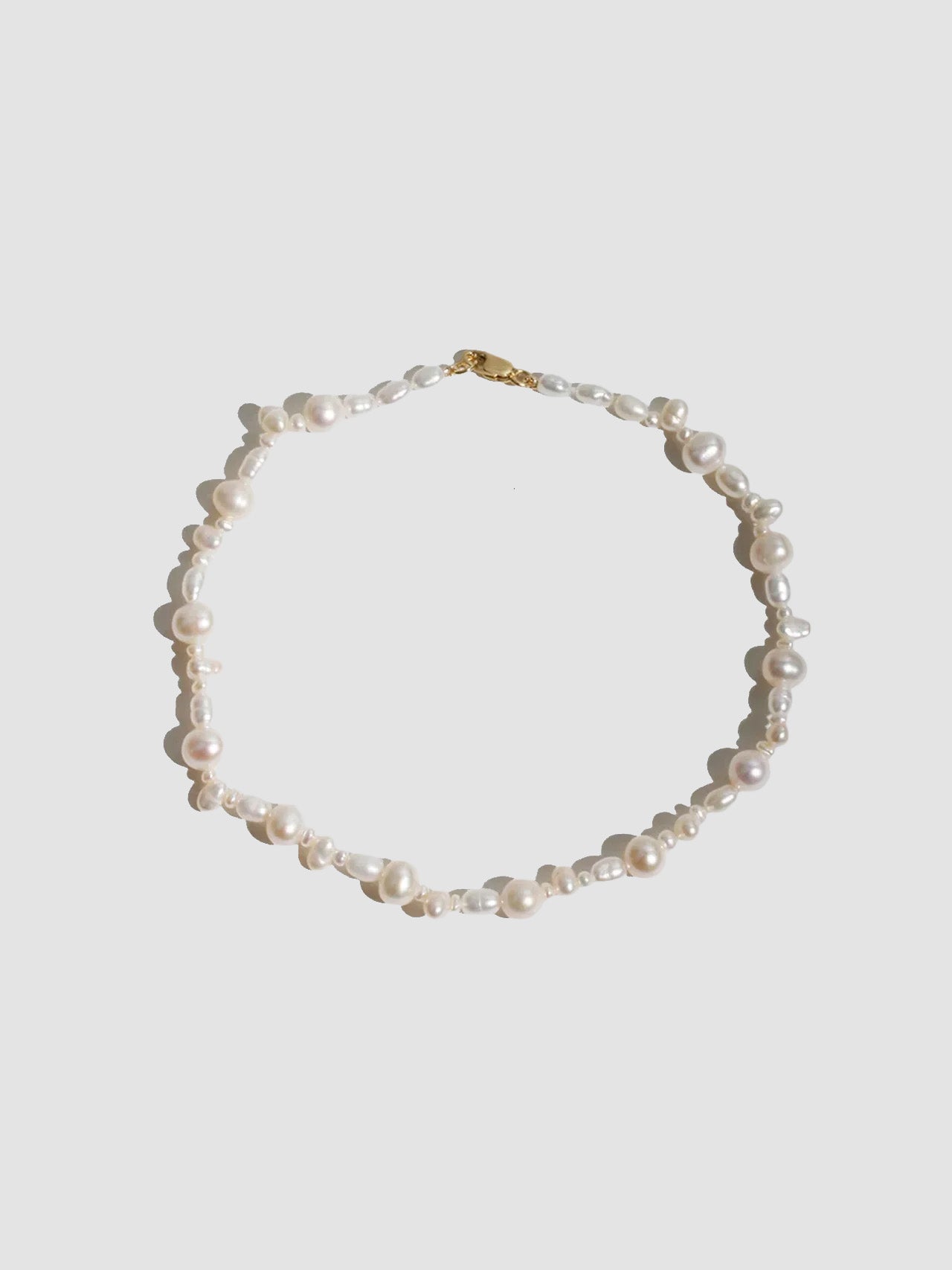 14kt Yellow Gold Bellissimo Pearl Anklet pictured on light grey background.