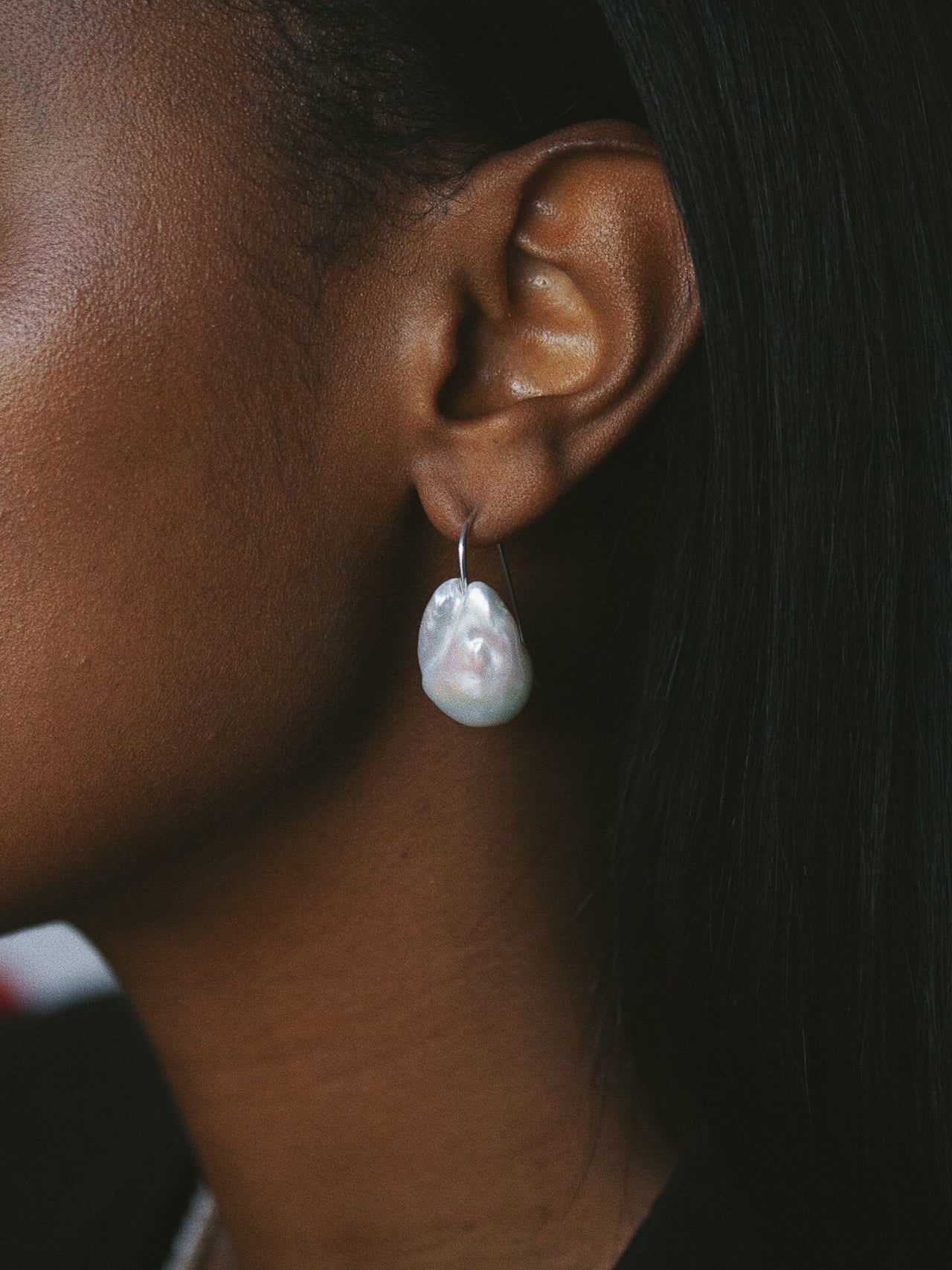Mini Frenchie Baroque Earrings pictured worn on models ear. 