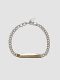 Watts ID Bracelet: Sterling Silver Curb Chain with a 14Kt Gold ID Centerpiece Length: 7’ (adjustable)