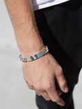 Sterling Silver Solid Curb Chain ID Bracelet pictured on male models hand.