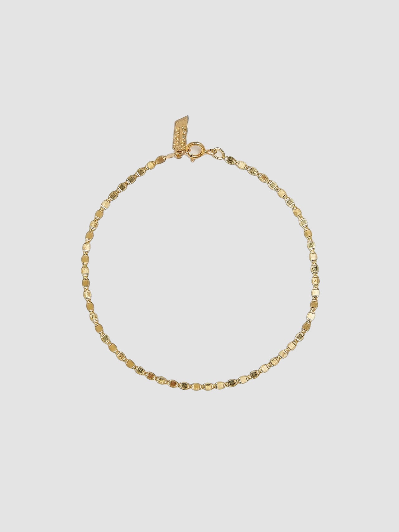 Product image of 14kt yellow gold valentino chain bracelet on white background. 