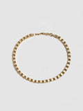10kt Yellow Gold Mini Alexander Chain Bracelet pictured on light grey background.