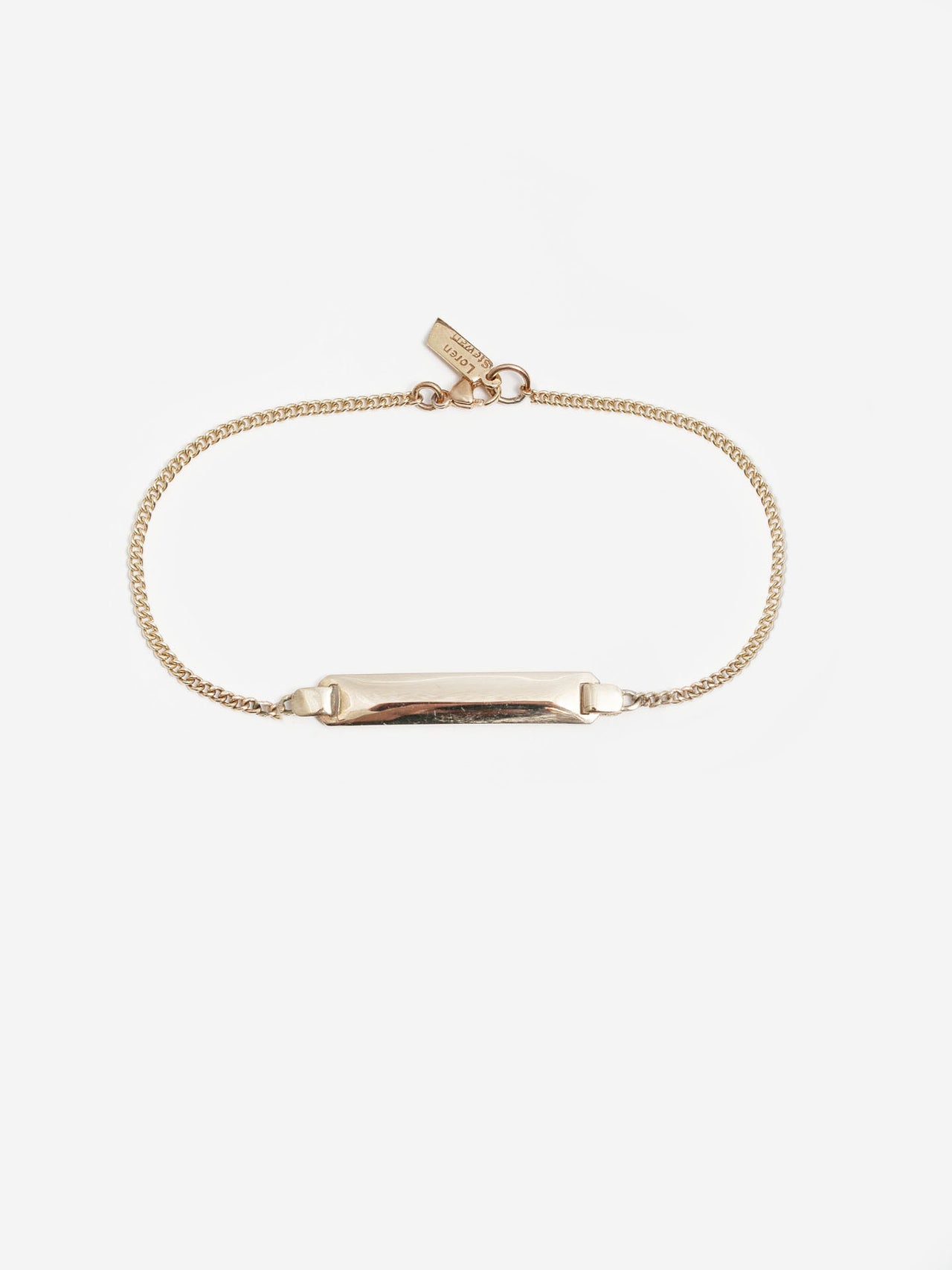 14kt Yellow Gold Mini Watts ID Bracelet pictured on light grey background.