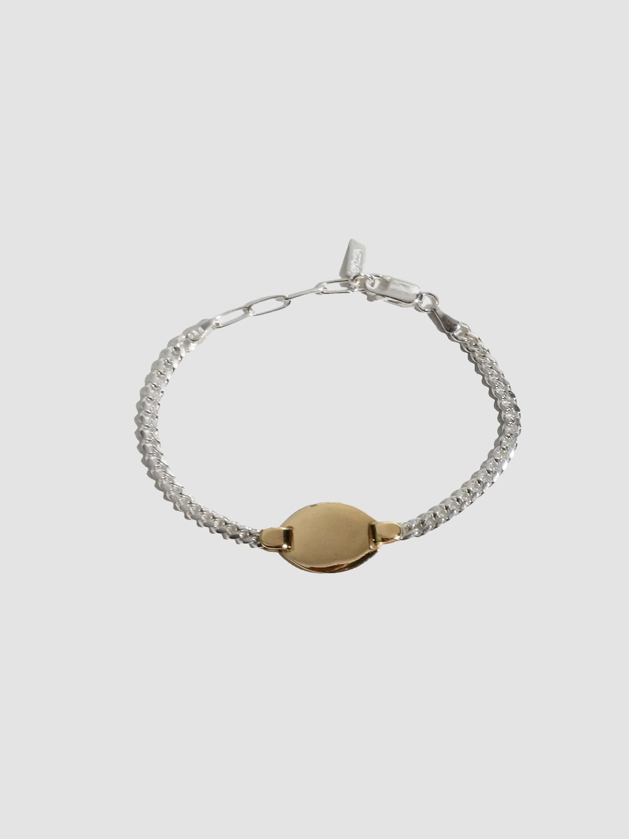 Mixed Metal ID Bracelet pictured on light grey background.