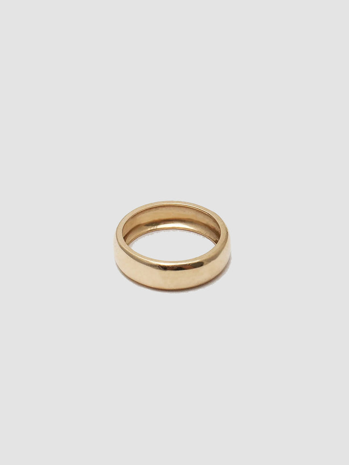 14kt Yellow Gold Dome Band pictured on light grey background. 