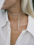 14kt Yellow Gold Pearl Necklace pictured on model. Adjusted so there is a dovetail pearl drop. 