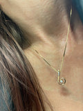 14kt Yellow Gold Diamond Squiggle Necklace shot on model.