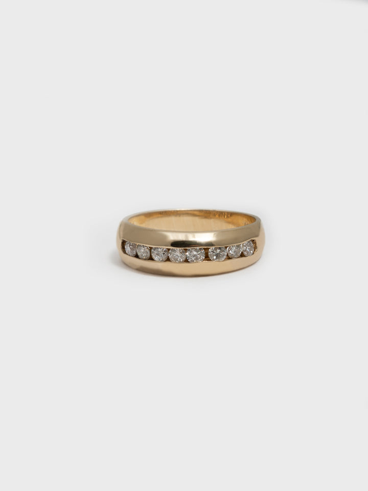14kt Yellow Gold Channel Set Diamond Ring on white background.