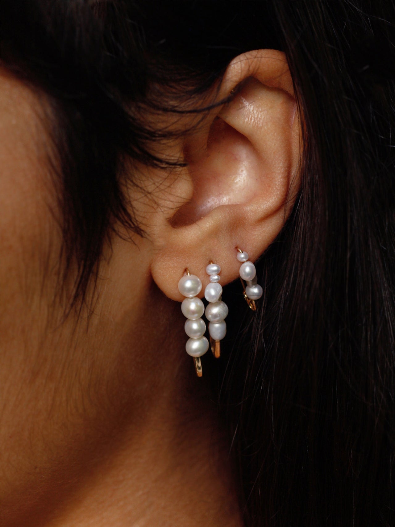 Mini Mixed Pearl Safety Pin Earring pictured on model.