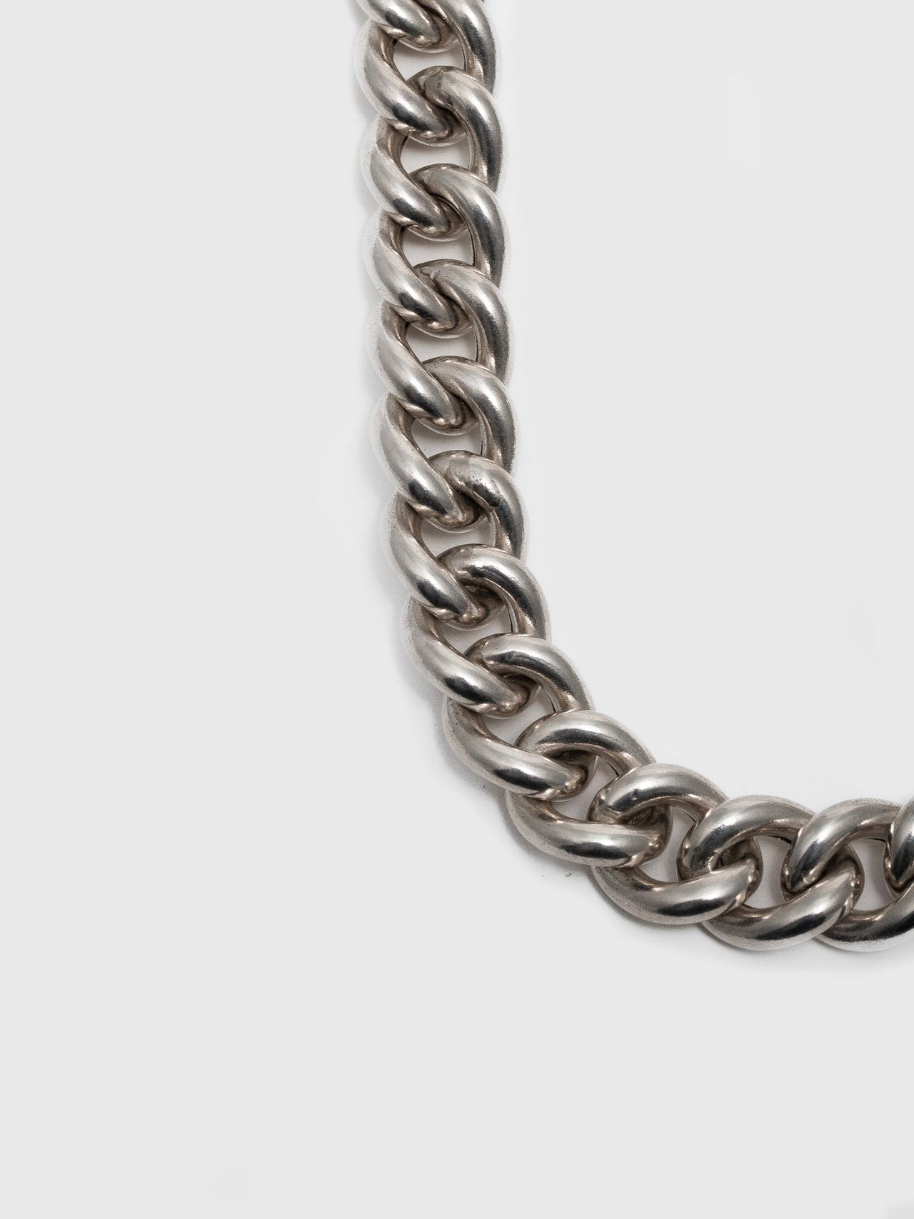 Sterling Silver XL industrial Curb Chain Necklace close up of chain. light grey background. 