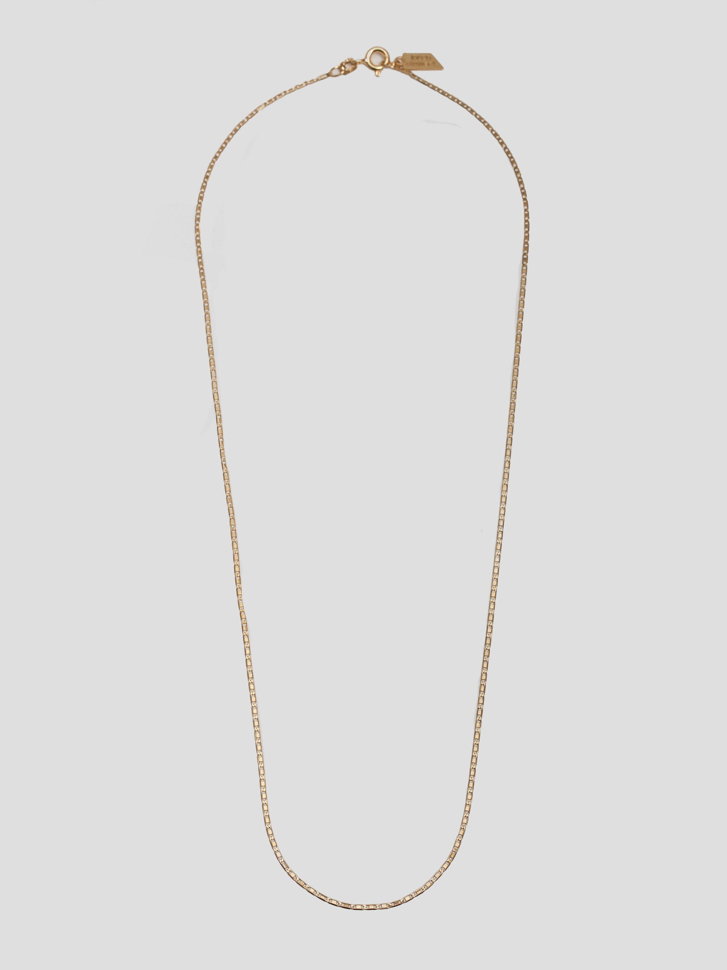 10kt Yellow Gold Valentino Chain pictured on light grey background. 