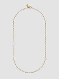 Gold chain necklace on a light gray background