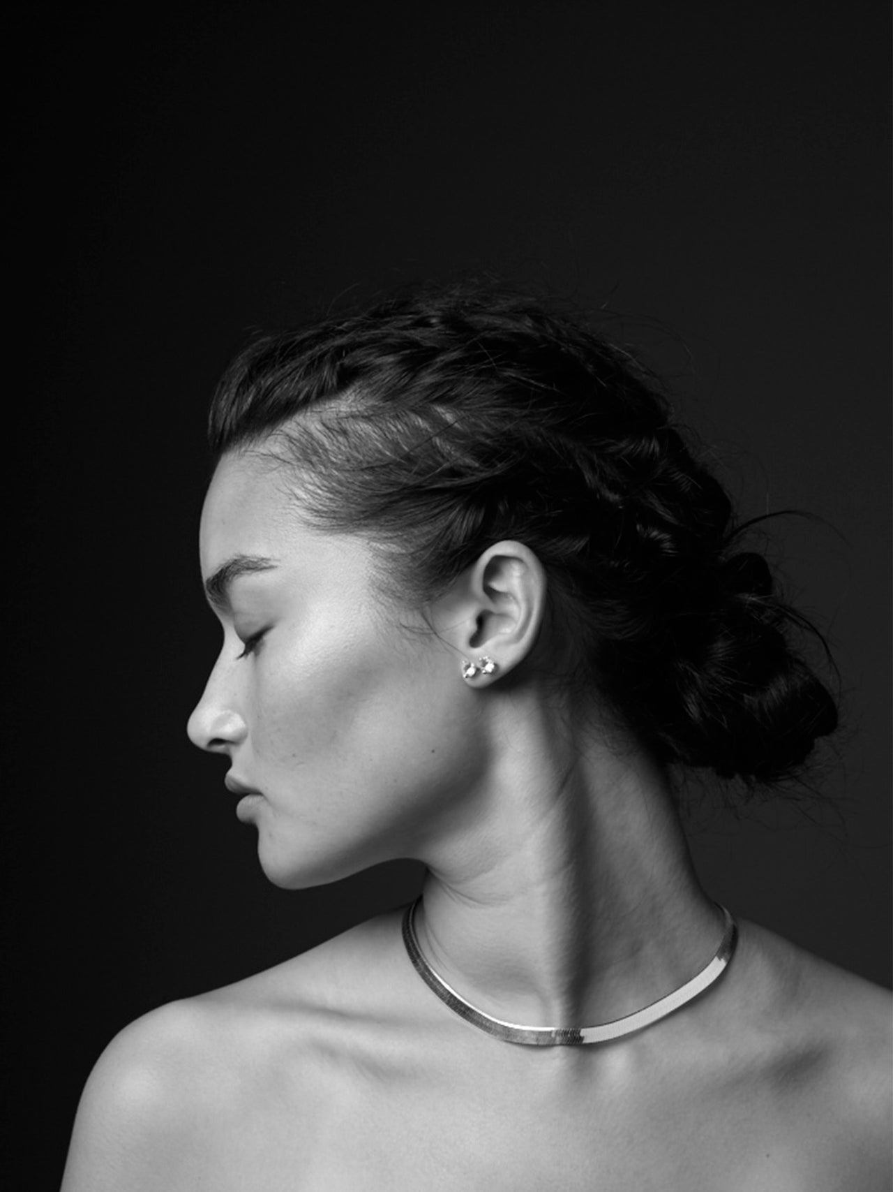 Sterling Silver Herringbone Chain Necklace pictured on model. shot in black and white. 