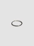 A sterling silver ring pictured on light grey background.
