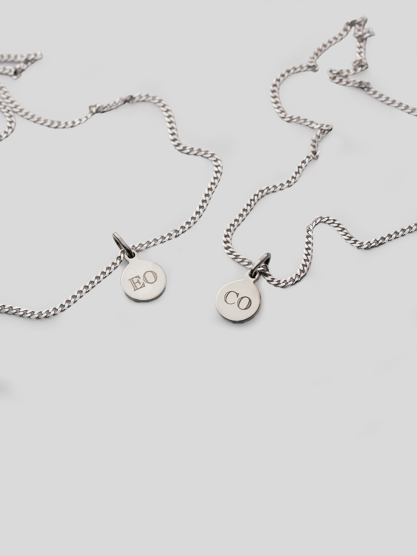 Sterling Silver Petite Havana Chain strung with the Mini Disk Pendant. Engraved initials with Block Font. 