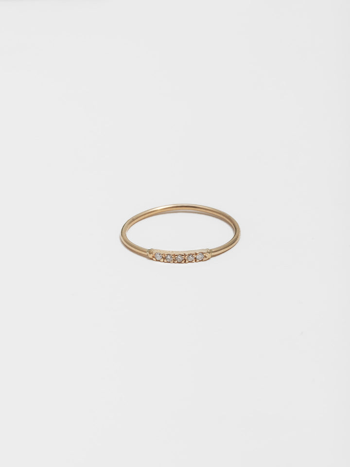 14kt Yellow Gold Diamond Baby Band pictured on light grey background. \